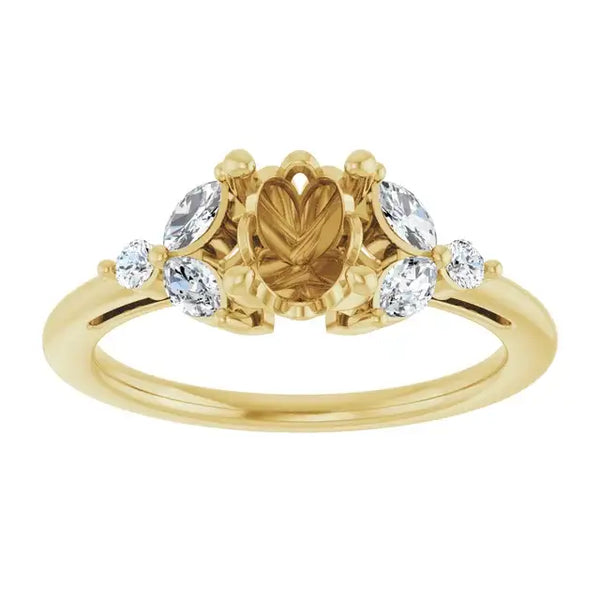 Gold engagement ring setting with oval center stone placeholder flanked by four round accent stones.