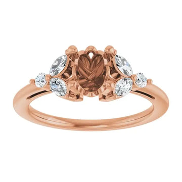 Rose gold engagement ring setting with oval center stone and four accent diamonds on sides.