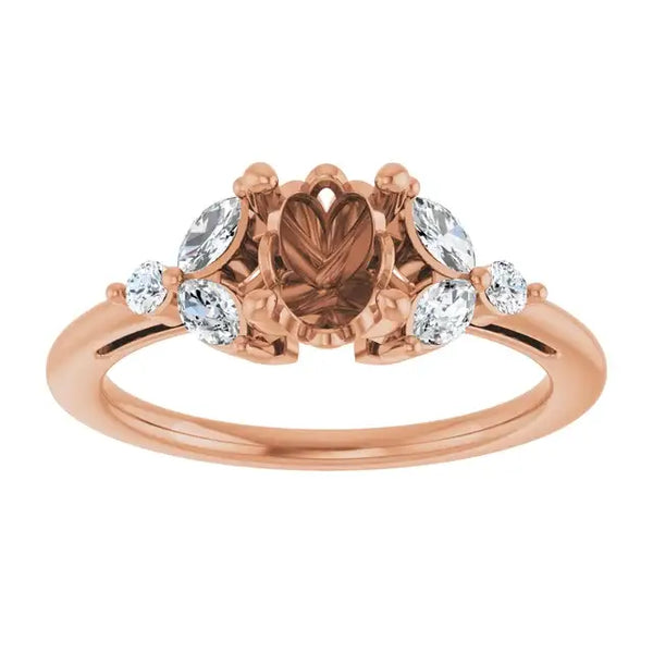 Rose gold engagement ring setting with heart-shaped center stone and oval lab-grown diamonds on sides.