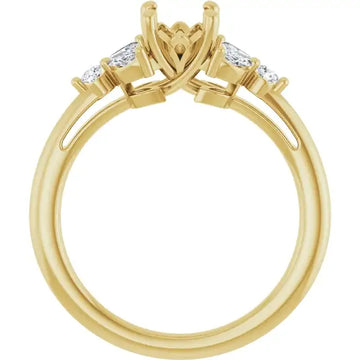 Yellow gold engagement ring setting with oval-shaped center stone holder and two rectangular accent stones on sides.