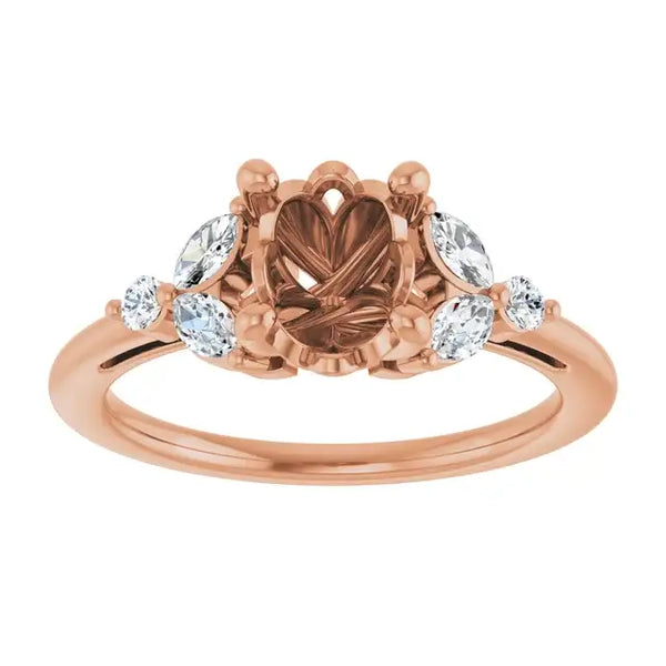 Rose gold engagement ring setting with oval center stone and round accent stones on sides.