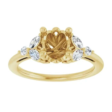 Yellow gold engagement ring setting with oval center stone holder and four round side stones.