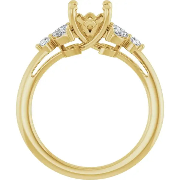Yellow gold engagement ring setting with oval stone holder and two round accent stones on shoulders.