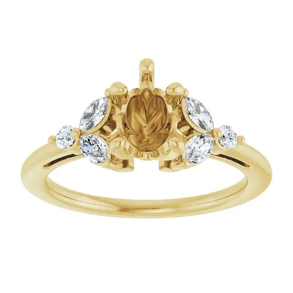 Gold engagement ring setting with pear-shaped center stone and oval accent diamonds on either side.