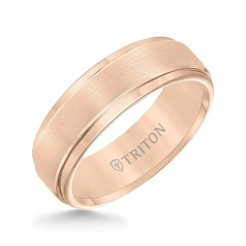 Angled view of a 7mm rose-tone tungsten carbide ring by Triton with satin-finished raised center and polished step edges