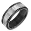 Angled view of a men’s wedding band featuring a black tungsten exterior with a serrated, vertically notched white gold center channel