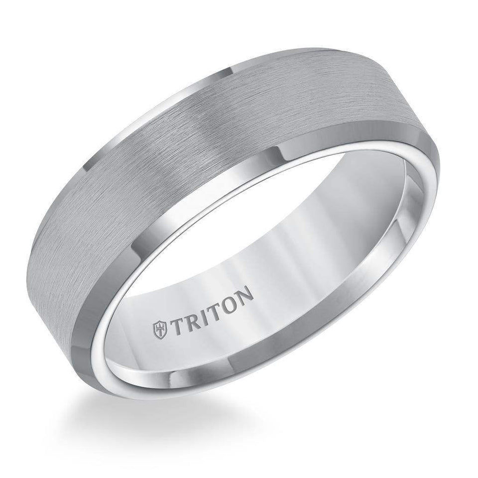 Angled view of a 7mm gunmetal gray tungsten carbide ring with satin center and polished beveled edges, engraved TRITON inside