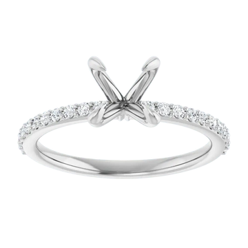 White gold engagement ring setting with V-shaped prongs and diamond-studded band for round stones.