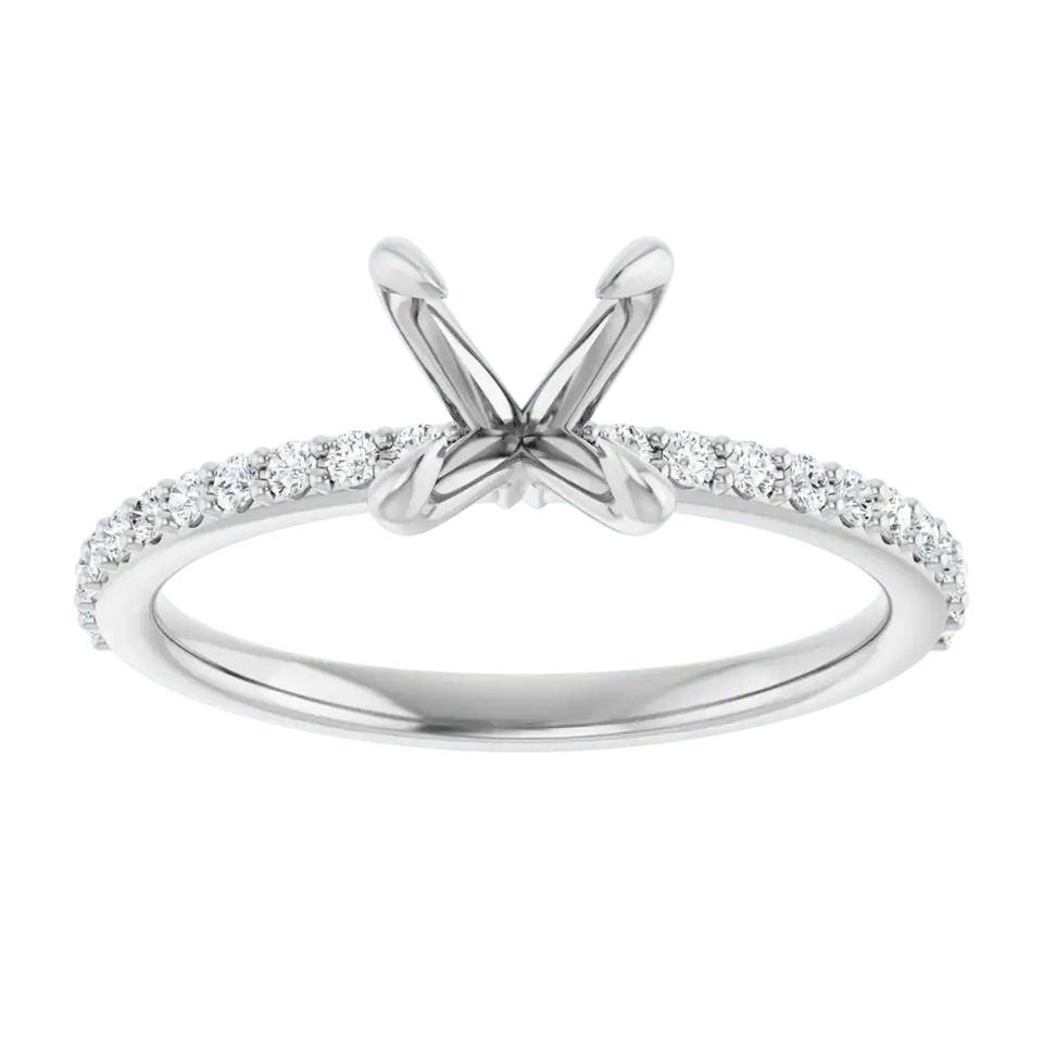 White gold engagement ring setting with V-shaped prongs and diamond-studded band for round stones.