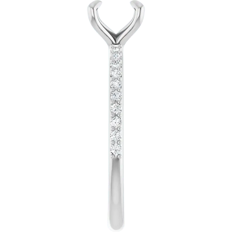 White gold engagement ring setting with V-shaped top, diamond-studded shaft, and open prong cup for round stone.