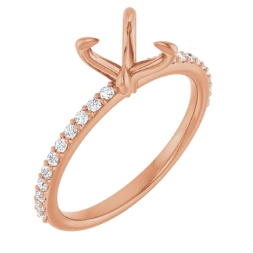 Rose gold engagement ring setting with claw prong center and diamond accents along the band.