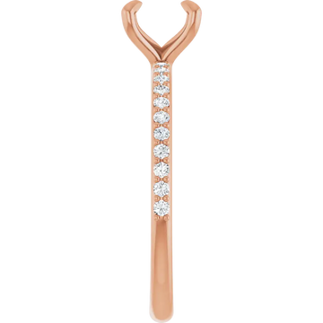Rose gold engagement ring setting with V-shaped prongs at top and round diamond accents along the shank.
