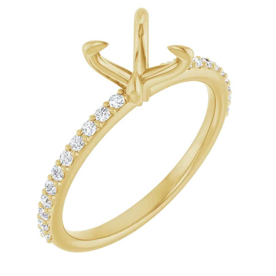 Gold engagement ring setting with round diamond accent stones along the band and open prongs at top.