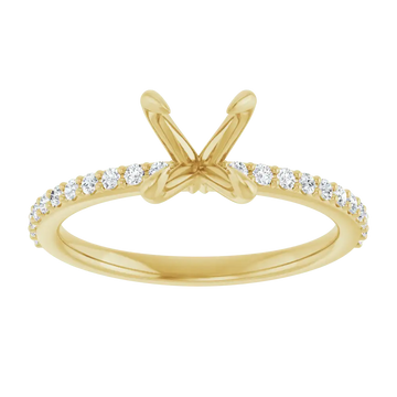 Gold engagement ring setting with split prongs and round diamond accent stones along the band.