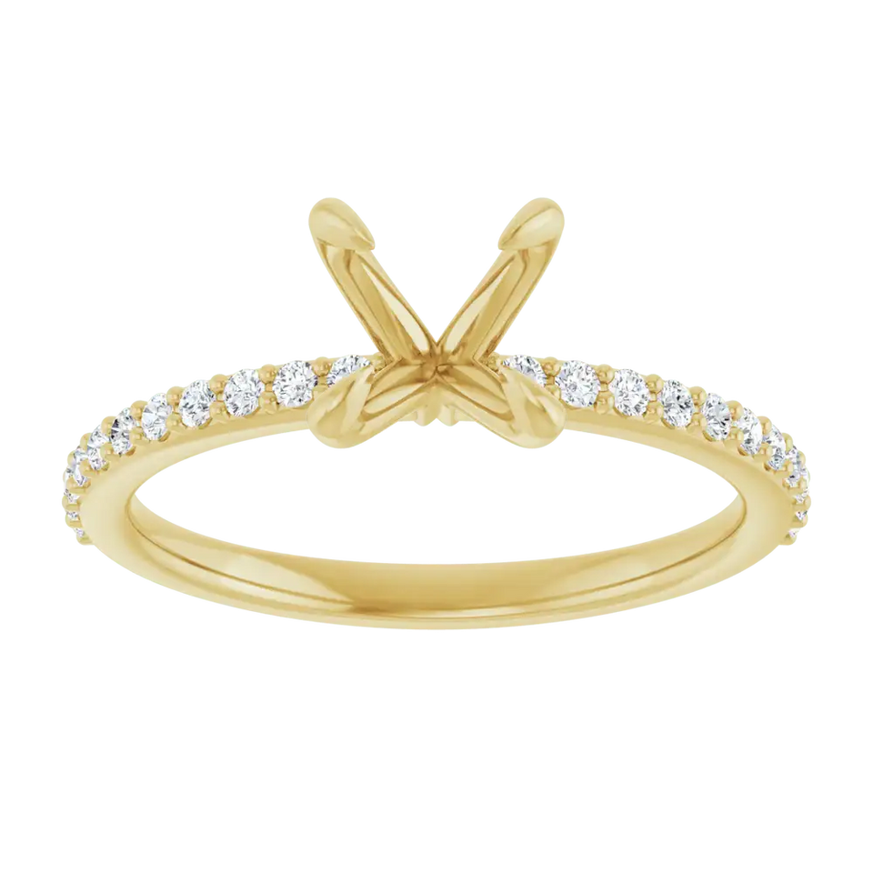 Gold engagement ring setting with split prongs and round diamond accent stones along the band.