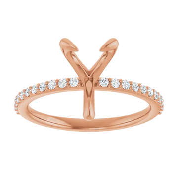 Rose gold engagement ring setting with V-shaped head for pear stone and diamond-accented band.