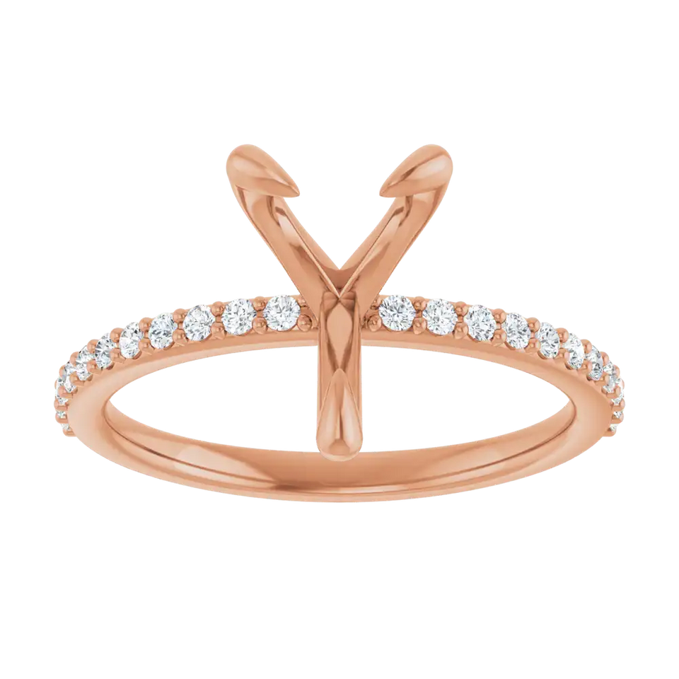 Rose gold engagement ring setting with V-shaped head for pear stone and diamond-accented band.