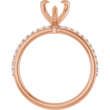 Rose gold engagement ring setting with pear-shaped stone holder and small diamonds set along the band.