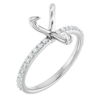 White metal engagement ring setting with pear-shaped stone holder and diamond-accented band.