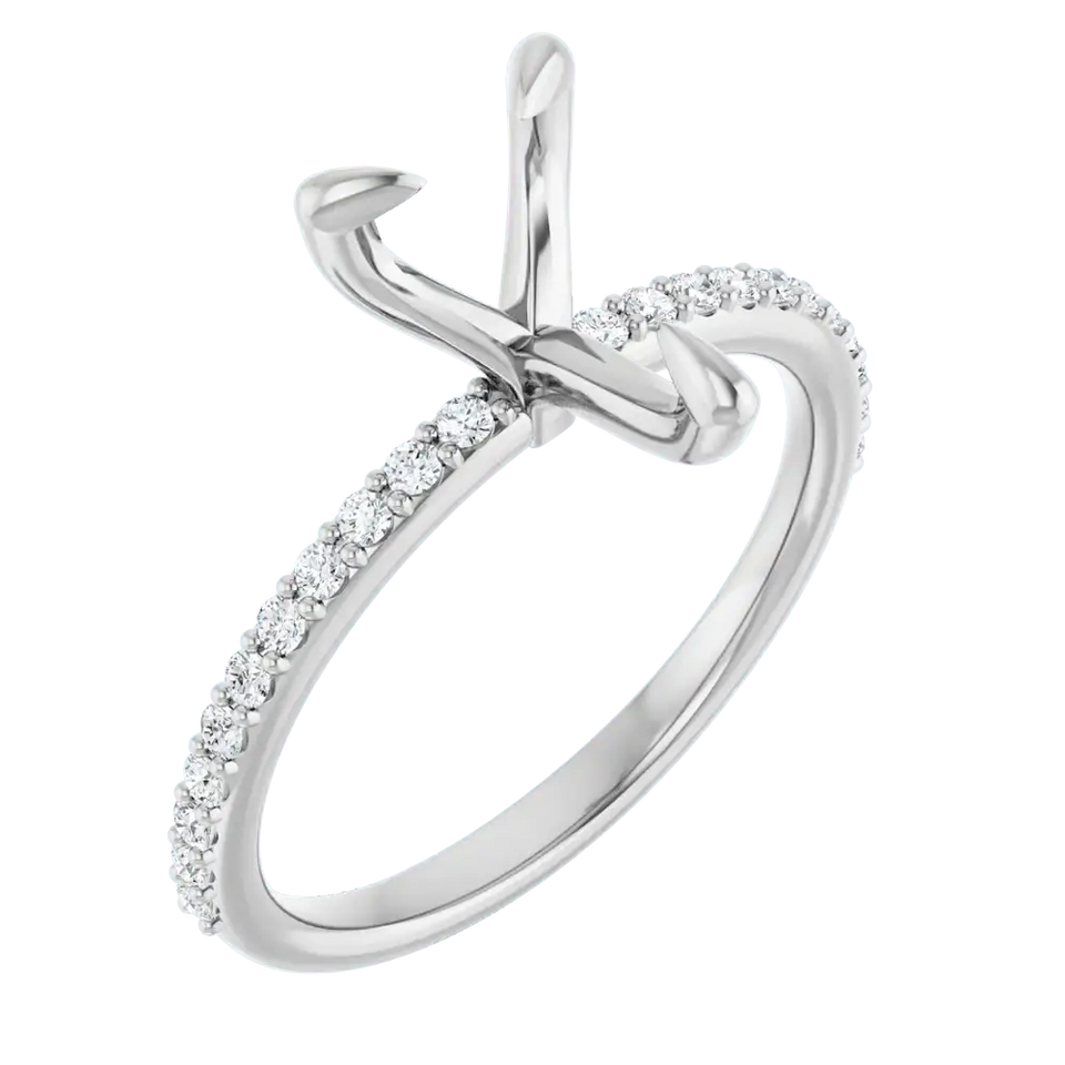 White metal engagement ring setting with pear-shaped stone holder and diamond-accented band.