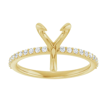 Yellow gold engagement ring setting with V-shaped prongs and diamond accents along the band.