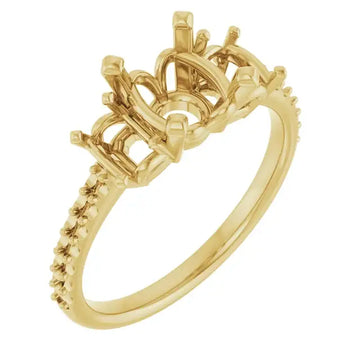 Gold engagement ring setting with ornate crown-shaped head and textured band designed for round center stones.