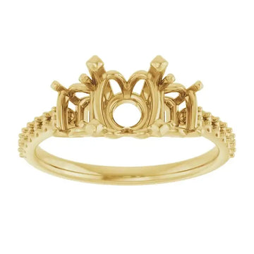 Gold engagement ring setting with ornate arched center gallery, side accents, and textured band designed for round stones.