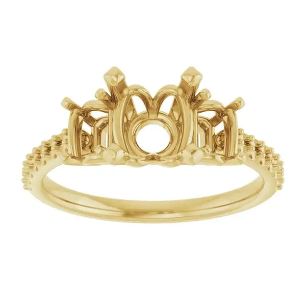 Gold engagement ring setting with ornate arched center gallery, side accents, and textured band designed for round stones.