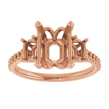 Rose gold engagement ring setting with octagonal center stone holder and decorative scrollwork shoulders.