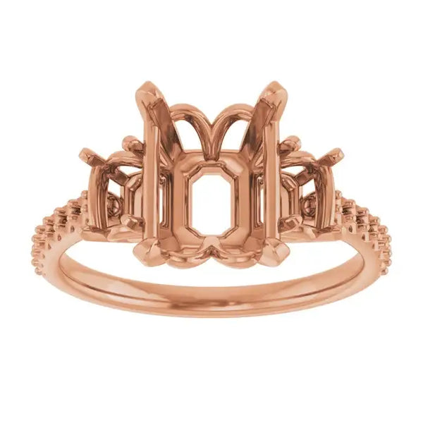 Rose gold engagement ring setting with octagonal center stone holder and decorative scrollwork shoulders.