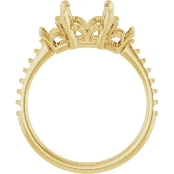 Yellow gold engagement ring setting with ornate crown-style head and studded band, designed for emerald stone placement.
