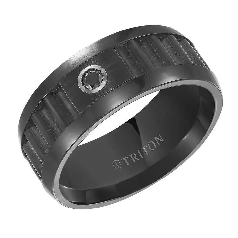 Angle view of 9mm black tungsten carbide men’s wedding band with corrugated center, polished rims, and a single bezel-set black diamond; interior engraved with TRITON