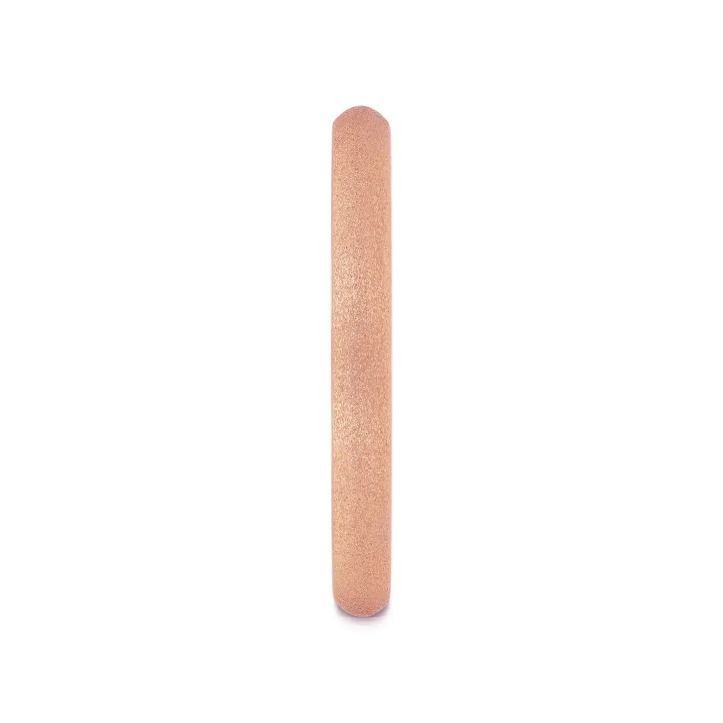 Angled view of a domed rose gold plated tungsten carbide ring showing sandblasted crystalline exterior and polished interior stamped Tungsten Carbide