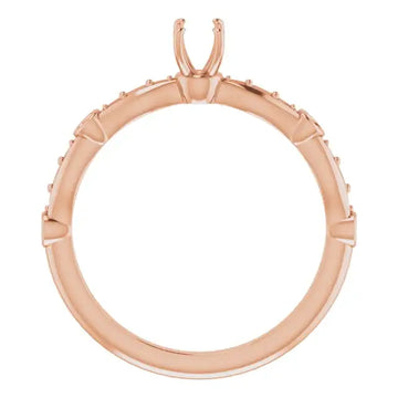 Rose gold engagement ring setting with accent stones and prongs for center stone, shown from top view.