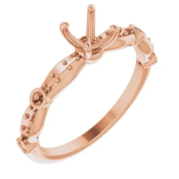 Rose gold engagement ring setting with square stone mount and decorative beaded detailing on band.