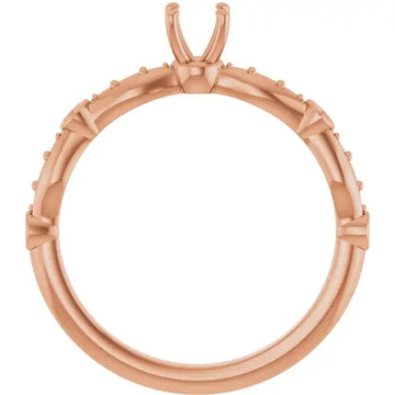 Rose gold engagement ring setting with U-shaped prongs and small accent stones around the band.