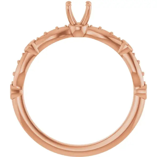 Rose gold engagement ring setting with U-shaped prongs and small accent stones around the band.
