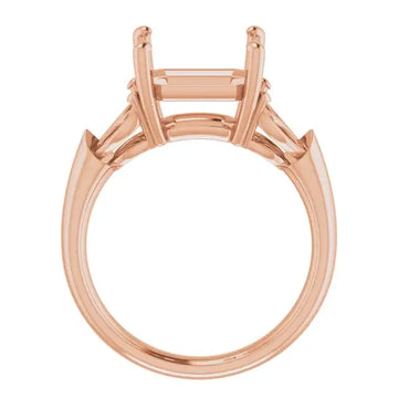 Rose gold engagement ring setting with empty square asscher stone holder and raised shoulder details.