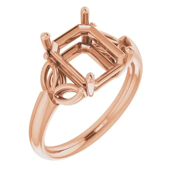 Rose gold engagement ring setting with emerald-cut stone holder and decorative side detailing.