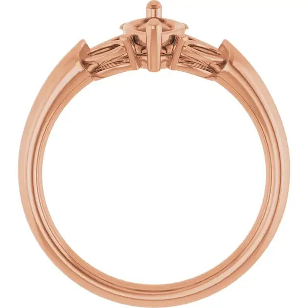 Rose gold engagement ring setting with marquise-shaped center stone and tapered baguette side stones.
