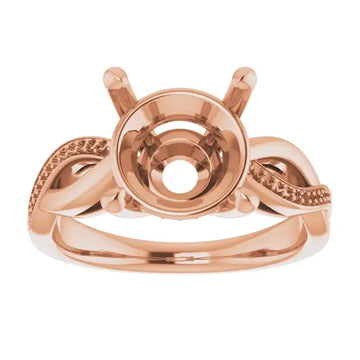 Rose gold engagement ring setting with twisted band design and round stone holder on white background.