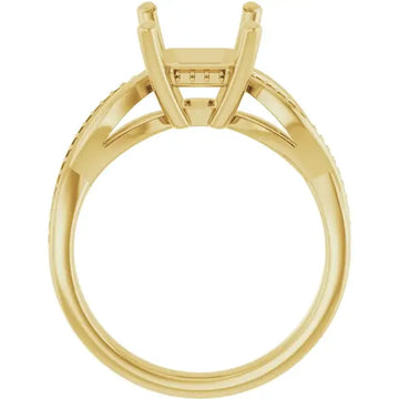 Yellow gold engagement ring setting with emerald-cut stone holder and diamond accents along the band.