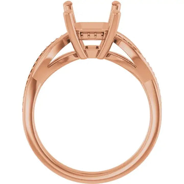 Rose gold engagement ring setting with emerald-cut stone holder and textured band.