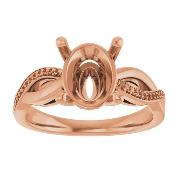 Rose gold engagement ring setting with oval stone head, textured twisted band, and decorative prongs.