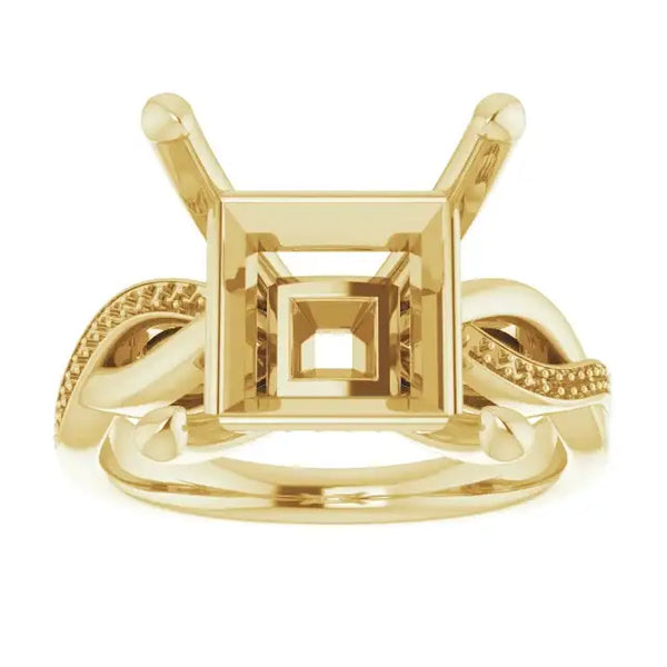 Gold engagement ring setting with square stone holder and twisted band details on sides.