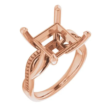 Rose gold engagement ring setting with square stone holder, decorative side accents, and textured band.
