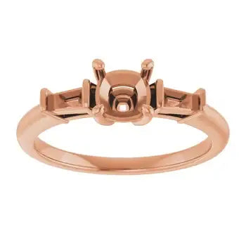 Rose gold engagement ring setting with cushion stone center and rectangular side stone accents.