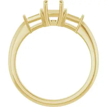 Gold engagement ring setting with four-prong head designed for emerald cut stones, shown from side view.