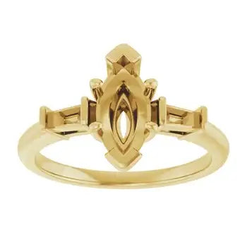 Gold engagement ring setting with marquise-shaped stone mount and decorative side details.