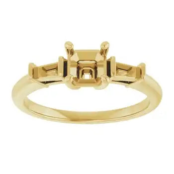 Gold engagement ring setting with asscher-cut stone holder in center and side stone accents.